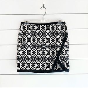 Express | Patterned slit mini skirt leather accent